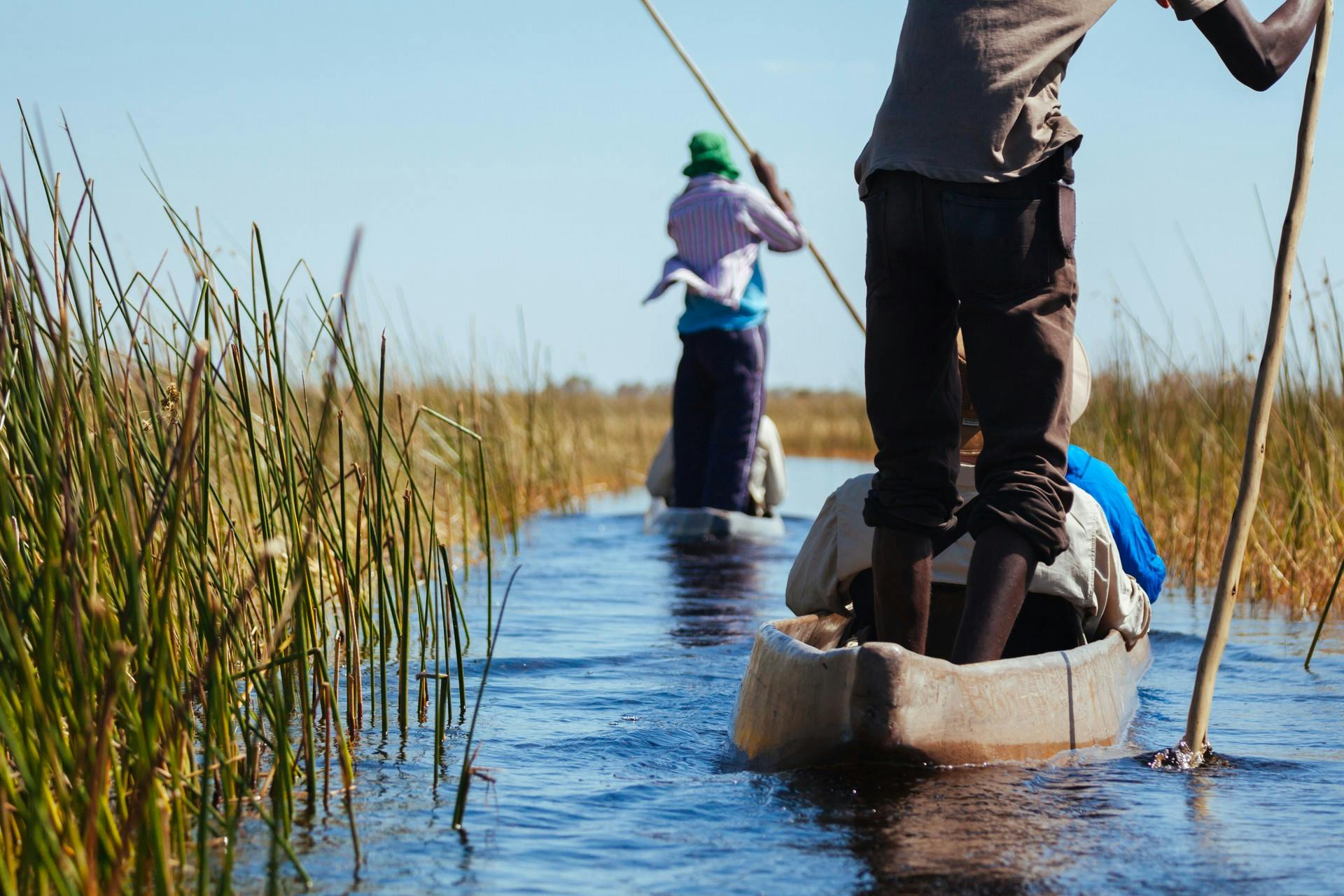 Local people giving a canoe tour in Botswana